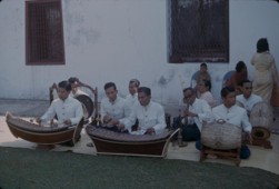 A piphat ensemble in Bangkok, circa 1963, showing ranat and khong wong in performance. The photograph illustrates the instrument family; it is not the exact six-instrument configuration simulated here.